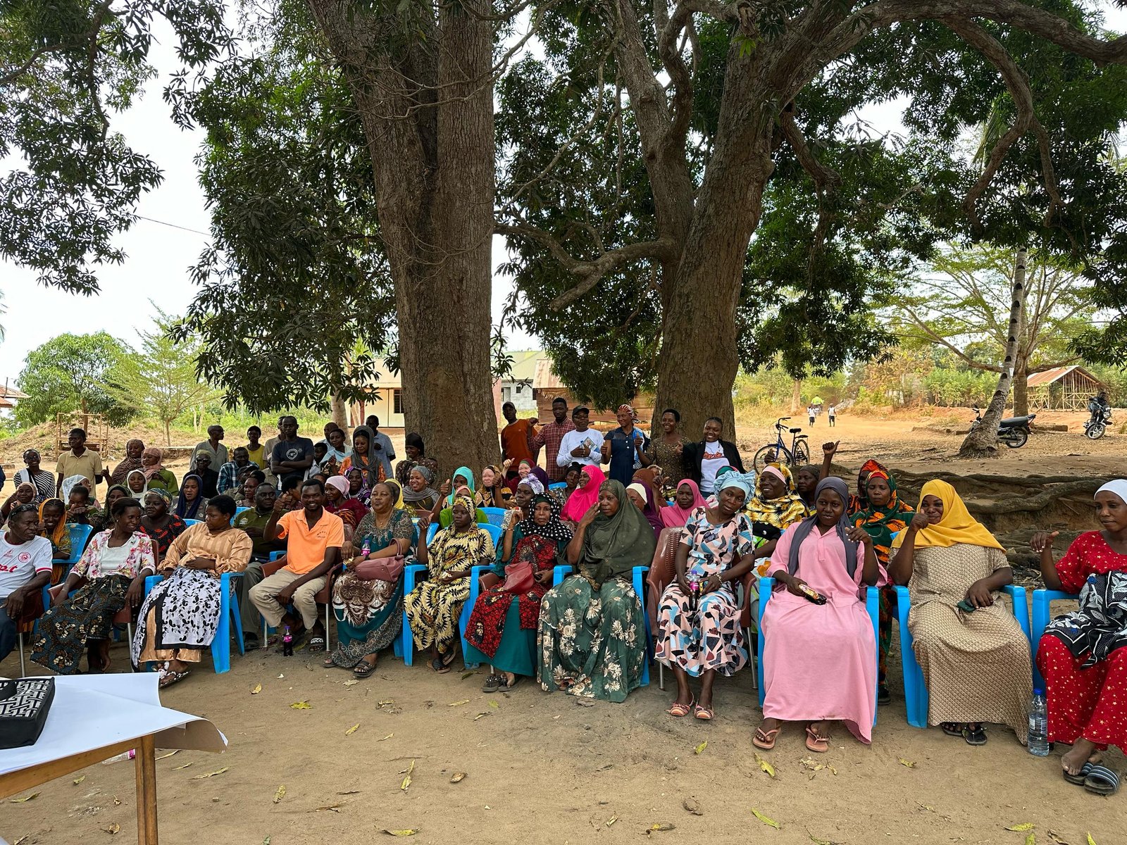 Community gathering listening to the sessions